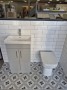 Portland 50cm Two Door Floorstanding Unit & Basin in Gloss Grey with Burshed Brass Handles