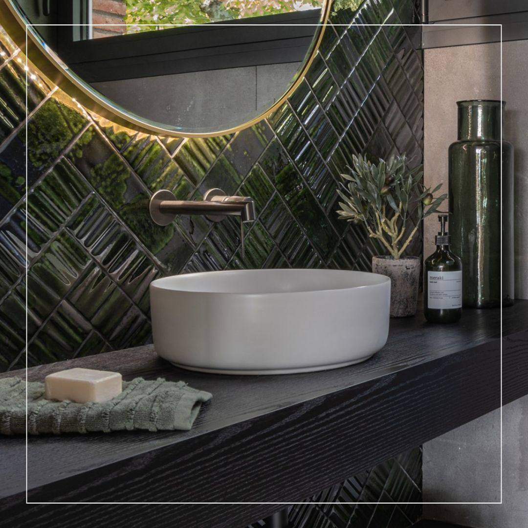 muddied green bathroom wall tiles