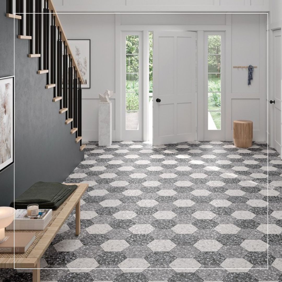 Black and white octagon terrazzo floor tiles in a modern hallway interior with geometric patterned design.