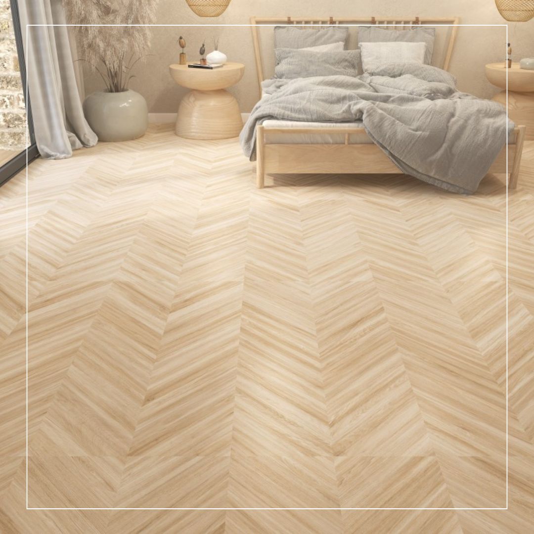 Scandinavian-style bedroom featuring light wood-effect porcelain floor tiles laid in a herringbone pattern