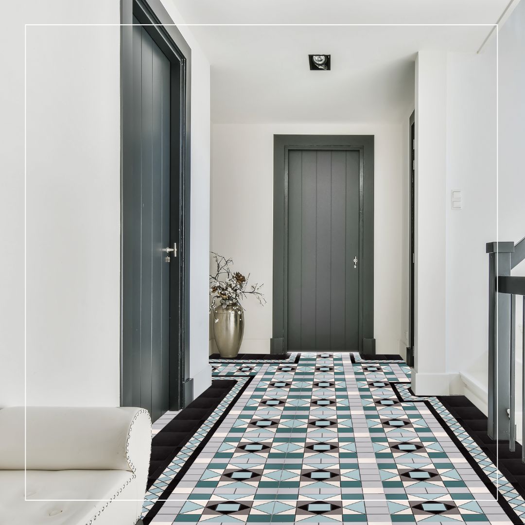 teal and white victorian porcelain hallway tiles in a geometric checkerboard star pattern with black diamond accents and a decorative border