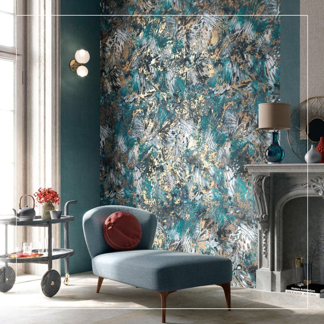 Interior featuring decorative wall tiles with an abstract blue, teal, and gold pattern, creating a bold artistic feature wall with a textured, metallic finish