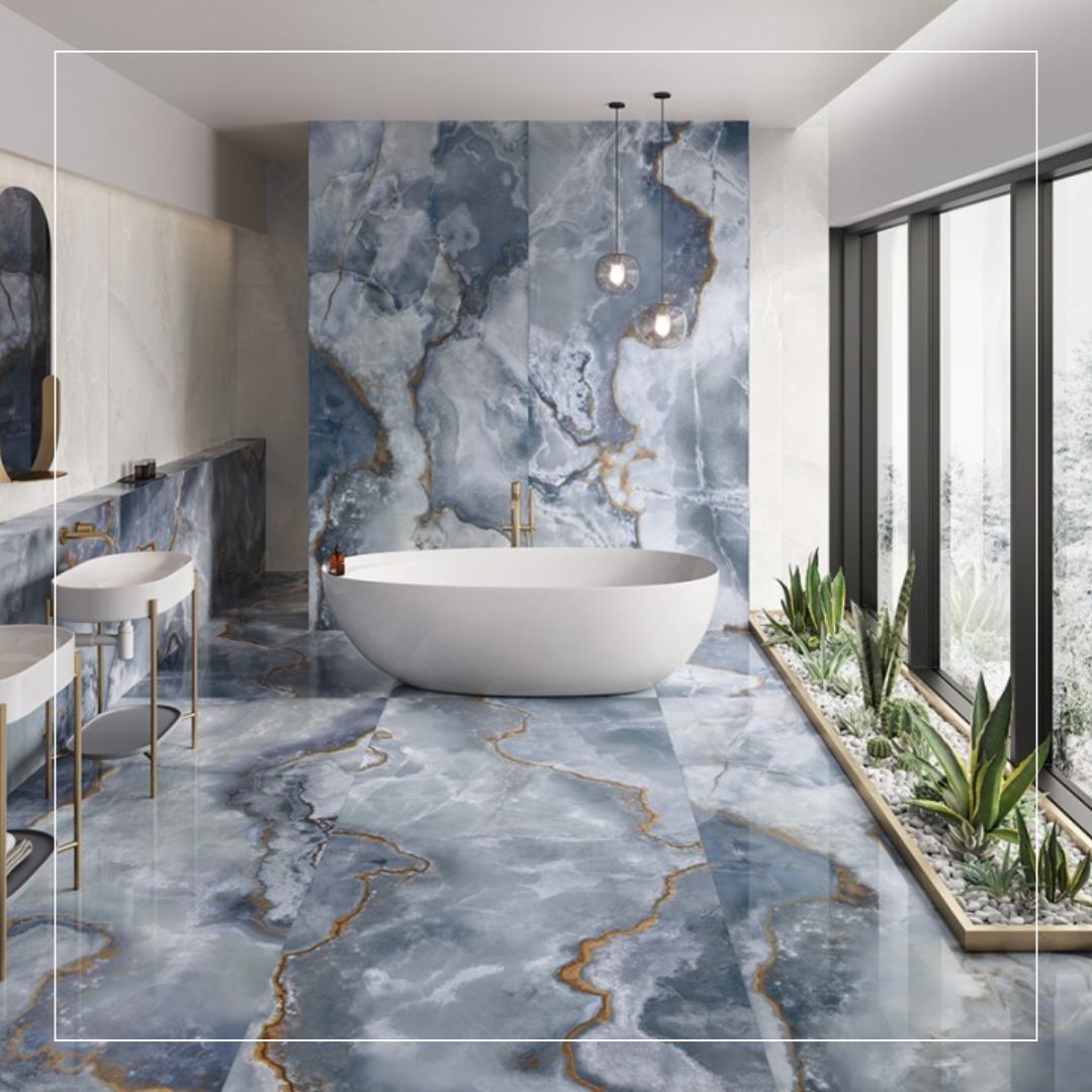 Luxury bathroom featuring large-format blue marble-effect tiles with gold veining on walls and floor