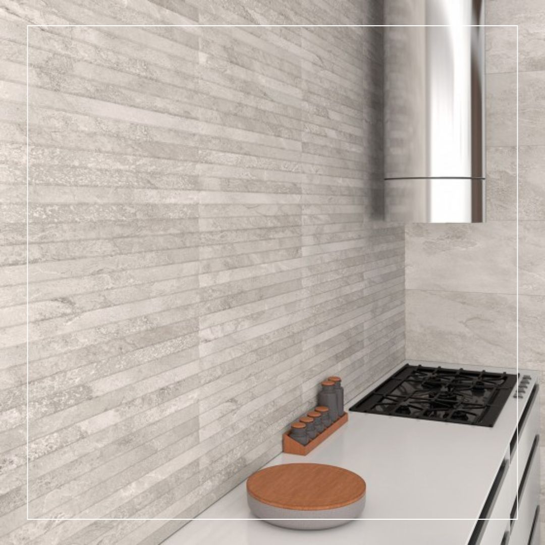 Close-up of modern kitchen with light grey stone effect splashback tiles