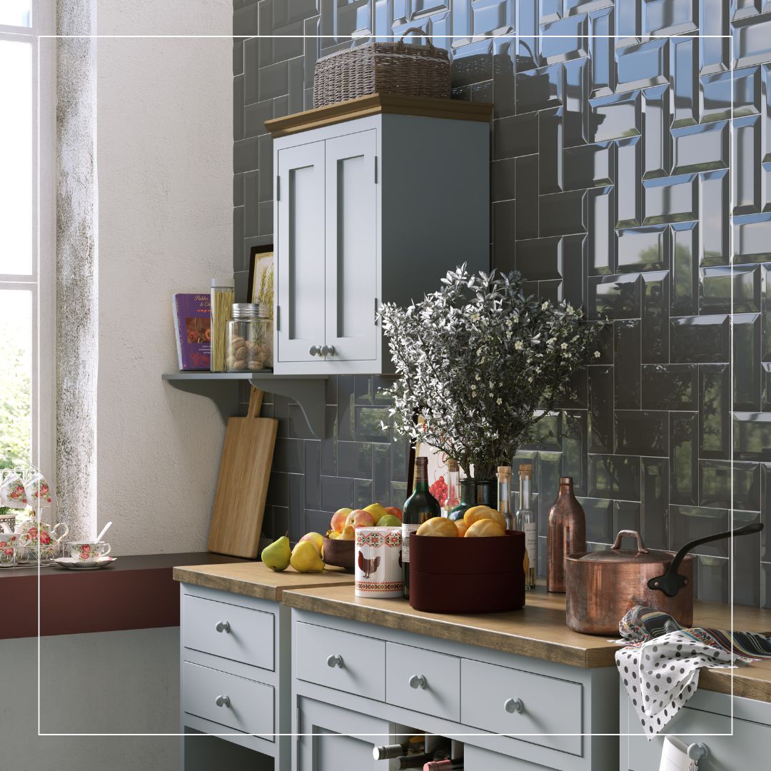 Traditional style kitchen with glossy dark metro tile splashback, light grey cabinets, and wooden worktop
