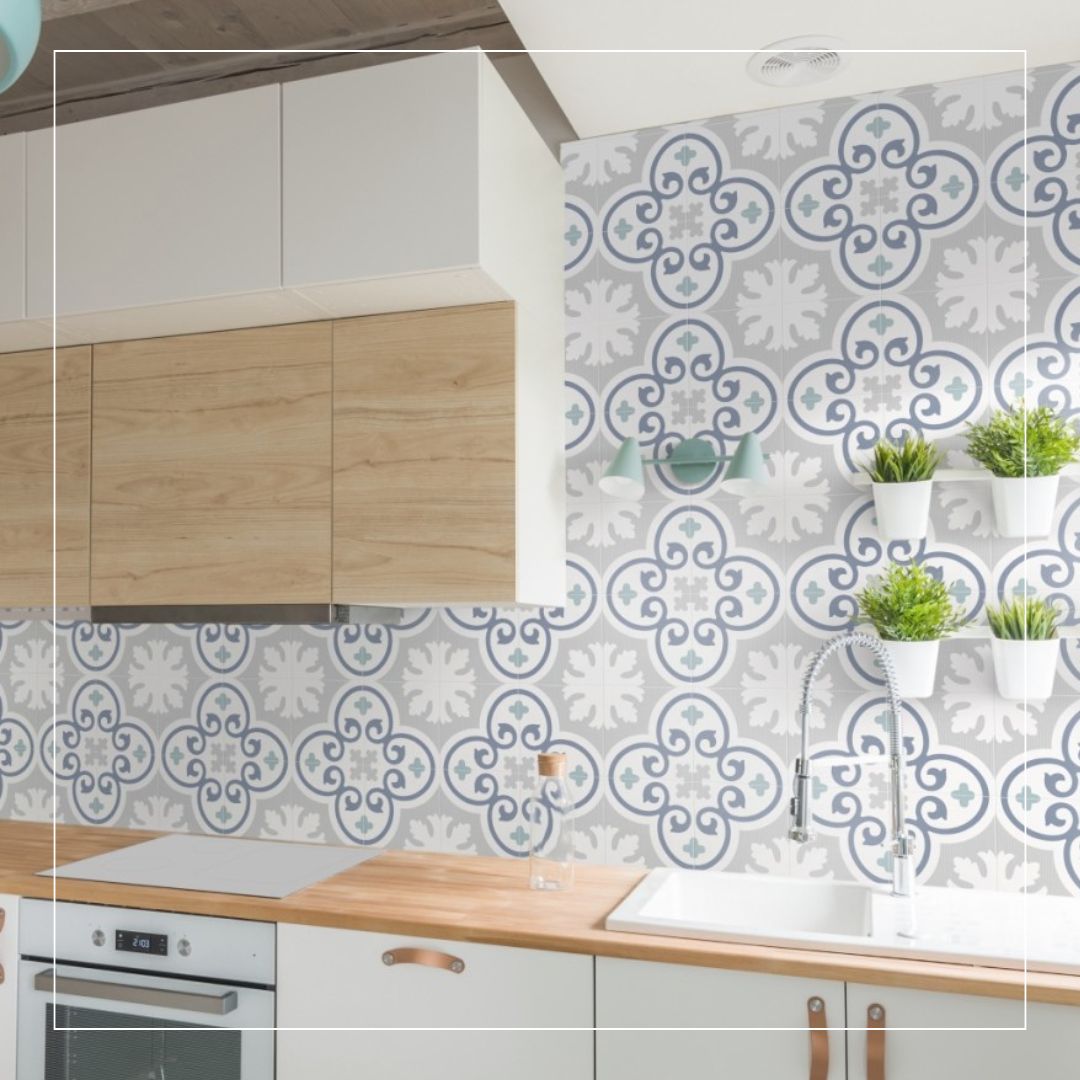 Modern kitchen with decorative patterned splashback tiles in blue and grey tones