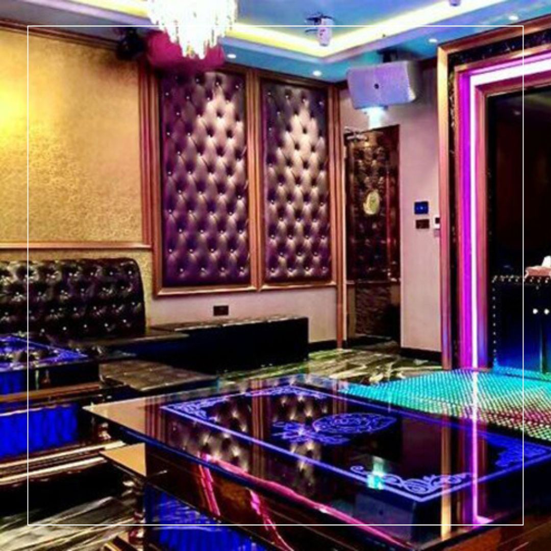 Immersive karaoke suite with premium porcelain floor and LED detailing — leisure venue refurbishment with slip-resistant flooring for bars and clubs.