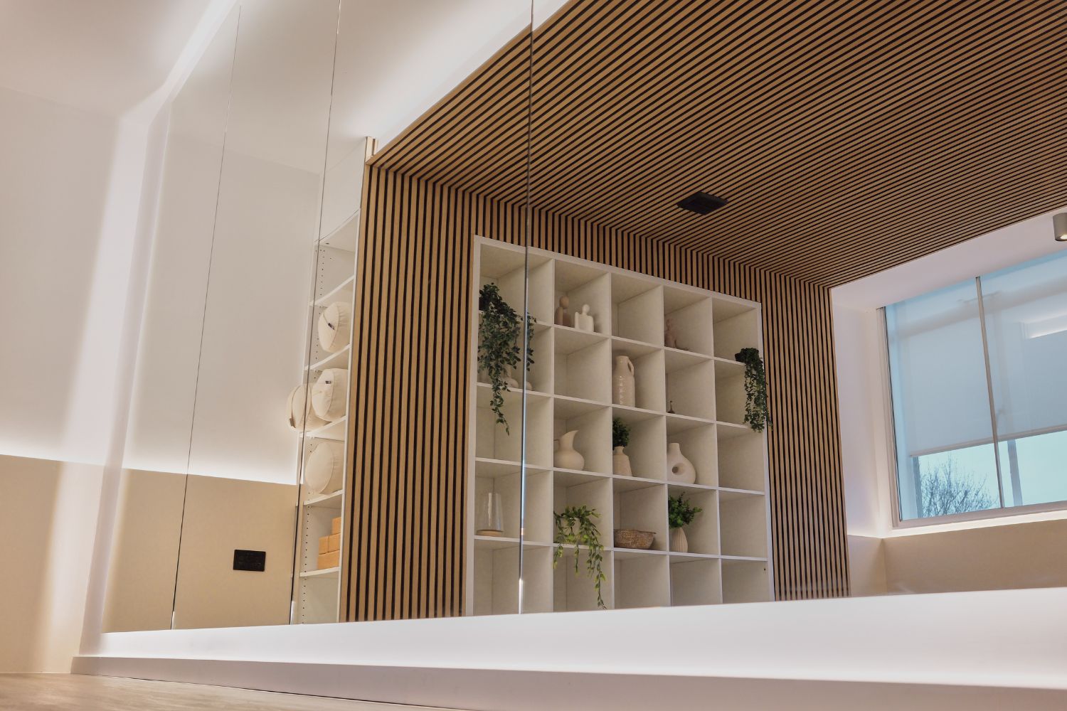 Classic Oak acoustic wall panels and bespoke floor-to-ceiling mirrors at ADC Gym