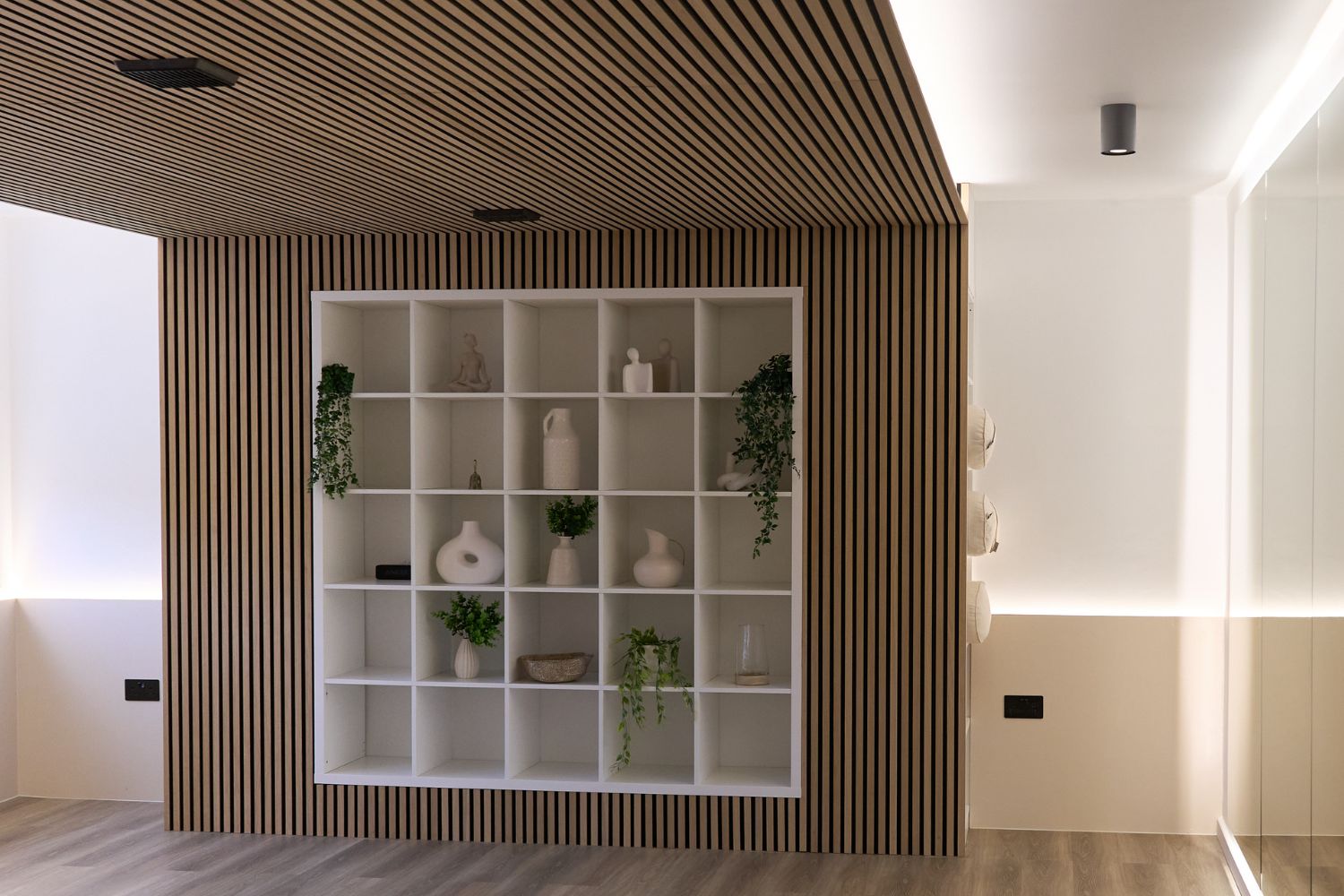 Classic Oak acoustic wall panels and bespoke floor-to-ceiling mirrors at ADC Gym